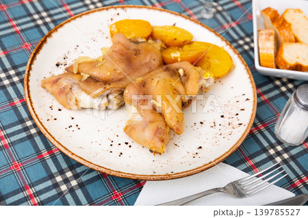 Stewed pig trotters with potato, homemade dinner Stewed pig trotters with potato, homemade dinner 139785527