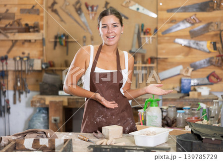 Girl is busy in carpentry workshop 139785729