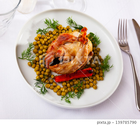 Grilled whole quail with baked carrots, green peas and dill Grilled whole quail with baked carrots, green peas and dill 139785790