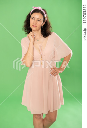 Portrait of adult woman in casual clothes posing in studio. Chroma key compositing 139785852