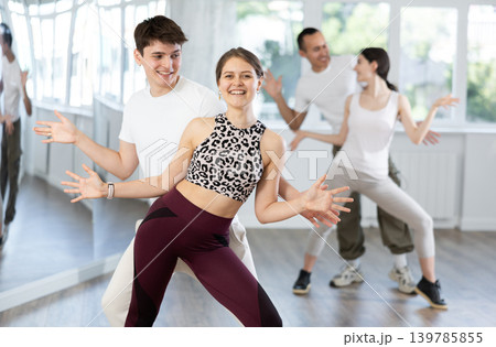 Couples of young men and women dancing twist 139785855
