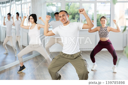 Young Asian dancer rehearsing krump dance moves in studio 139785898