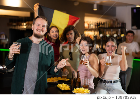 Group of fans in bar with Belgian flag 139785918