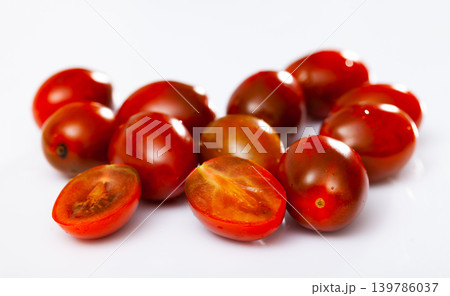 Whole fresh red cherry tomatoes on table. Healthy vegetarian ingredient 139786037