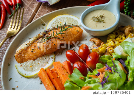 Grilled salmon fish fillet and fresh vegetable salad. Healthy food. Top view 139786401