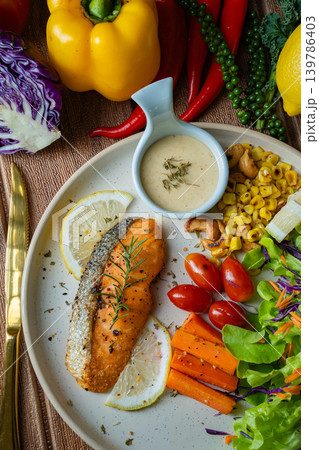Grilled salmon fish fillet and fresh vegetable salad. Healthy food. Top view 139786403