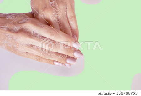 Hands in foam, Hands in soap. Creative background. Hand washing. Foam for washing. Hands in foam, Hands in soap. Creative background. Hand washing. Foam for washing. 139786765