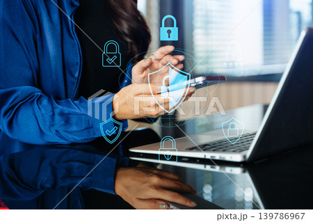 Cybersecurity and privacy concepts to protect data. Lock icon and network security technology. Man protecting personal data on smartphone tablet, virtual screen interfaces. In office 139786967