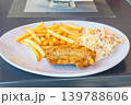 Cod with fries and salad. 139788606