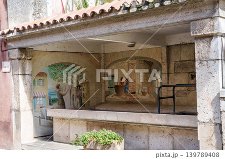 Aiguines, France - Sep 22, 2025: Picturesque old houses in the city of Aiguines in France nearby Lac de Sainte Croix. 139789408