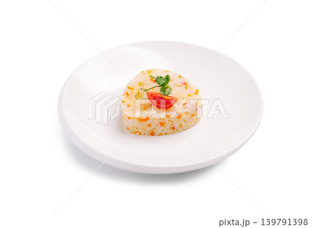 Heart shaped rice dish with tomato and herbs on white plate Heart shaped rice dish with tomato and herbs on white plate 139791398