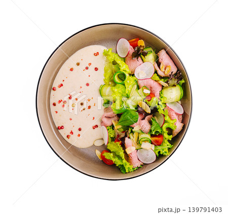 Roast beef salad with creamy sauce and vegetables for a healthy meal option at lunch time 139791403
