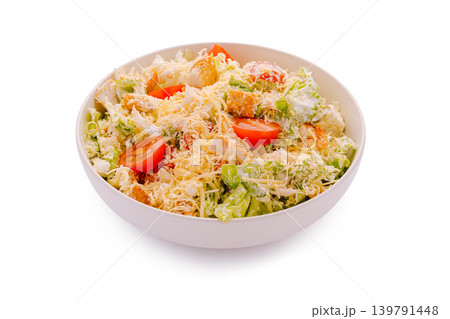 Fresh salad with vegetables and toppings in a white bowl 139791448