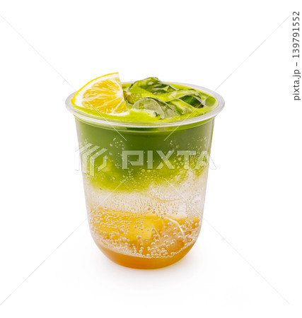 Fresh drink with layers of color served in a clear cup with lime on top Fresh drink with layers of color served in a clear cup with lime on top 139791552
