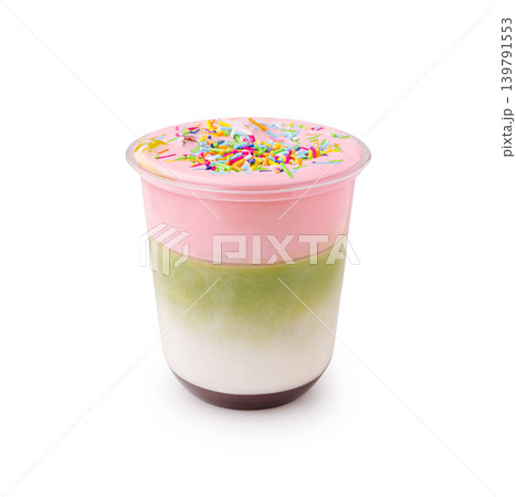 Layered dessert or drink with colorful frosting and sprinkles in a cup Layered dessert or drink with colorful frosting and sprinkles in a cup 139791553