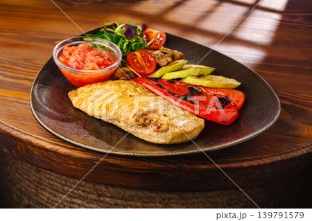Grilled chicken with vegetables and salsa on a plate for lunch Grilled chicken with vegetables and salsa on a plate for lunch 139791579