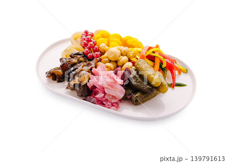 Colorful platter with assorted pickles and fruits in a simple setting 139791613