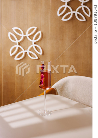 Drink sits on table in a cozy indoor setting with decorative wall design Drink sits on table in a cozy indoor setting with decorative wall design 139791643