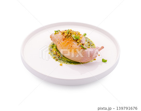 Delicious dish with cooked meat on a plate with sauce and toppings Delicious dish with cooked meat on a plate with sauce and toppings 139791676