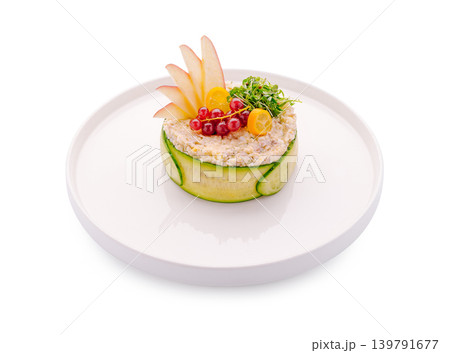 Creative food presentation on a white plate with fresh ingredients 139791677