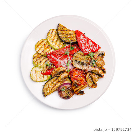 Grilled vegetables served on a white plate with fresh herbs 139791734