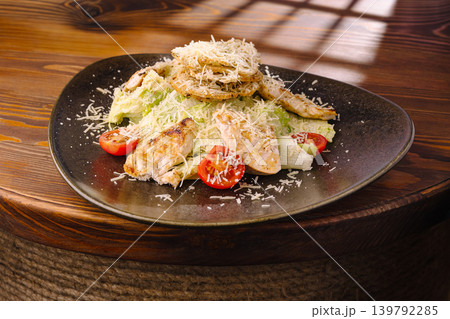 Healthy salad with grilled chicken and cheese served at a restaurant Healthy salad with grilled chicken and cheese served at a restaurant 139792285