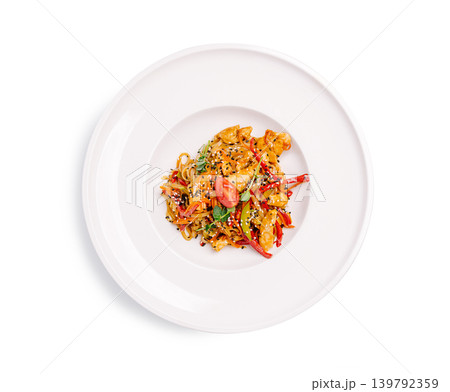 Chicken stir fry with mixed vegetables served on a white plate Chicken stir fry with mixed vegetables served on a white plate 139792359