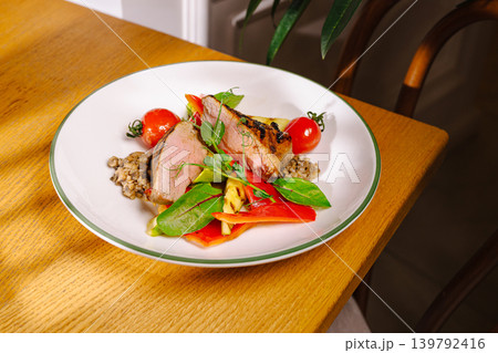 Roasted duck breast with grilled vegetables and tomatoes Roasted duck breast with grilled vegetables and tomatoes 139792416