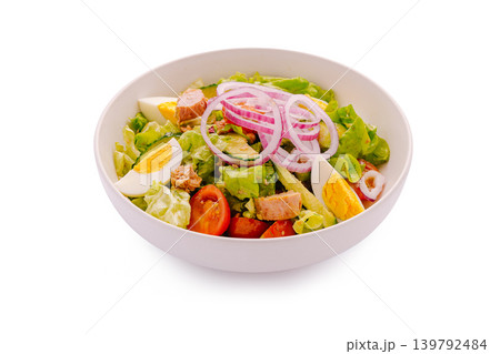 Fresh salad with tuna, eggs, and vegetables served in a bowl Fresh salad with tuna, eggs, and vegetables served in a bowl 139792484