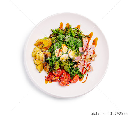 Fresh salad with grilled chicken, potatoes, and tomato served on a white plate Fresh salad with grilled chicken, potatoes, and tomato served on a white plate 139792555