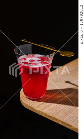 Refreshing drink on a wooden table with dark background at a cafe Refreshing drink on a wooden table with dark background at a cafe 139792612