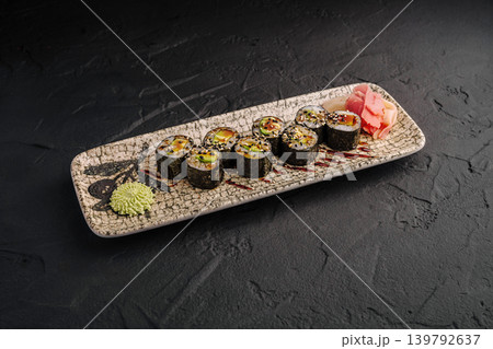 Sushi rolls with wasabi and ginger on a decorative plate served in a restaurant Sushi rolls with wasabi and ginger on a decorative plate served in a restaurant 139792637