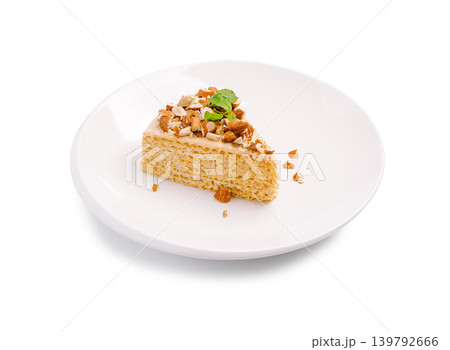 Waffle cake with condensed milk and almonds isolated Waffle cake with condensed milk and almonds isolated 139792666
