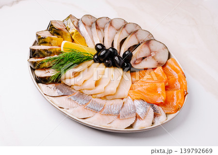Fresh seafood platter with various fish and garnishes for a special meal Fresh seafood platter with various fish and garnishes for a special meal 139792669