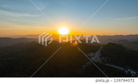 Aerial view of Golden Hour Above the Curving Peaks of Nan 139794072