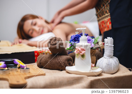 Woman relaxes during soothing back massage Woman relaxes during soothing back massage 139796023
