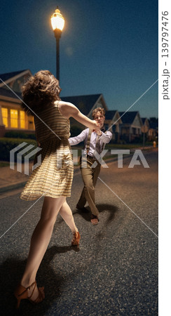 Lindy hop dance scene on suburban street at night under lamppost warm vintage mood 139797476