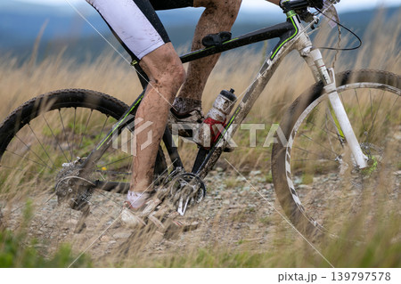 Close-up racer feet and mountain bike 139797578