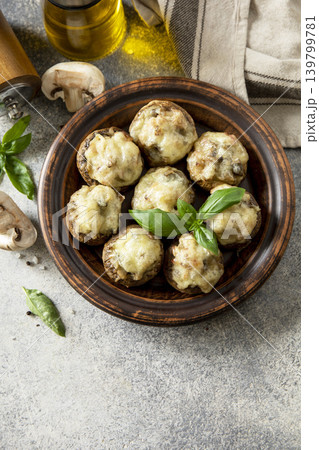 Keto stuffed mushrooms baked with cheese on a stone tabletop. Copy space. Keto stuffed mushrooms baked with cheese on a stone tabletop. Copy space. 139799781
