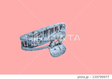 Plastic hair claw clip with speckled print. 139799977