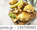 French pastry, freshly baked croissants with peanut butter and banana on a grey stone background. Healthy food dessert concept. Copy space. 139799985