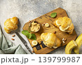 French pastry, freshly baked croissants with peanut butter and banana on a grey stone background. Healthy food dessert concept. View from above. 139799987