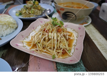 Thai Papaya Salad with Rice and Side Dishes Thai Papaya Salad with Rice and Side Dishes 139800203