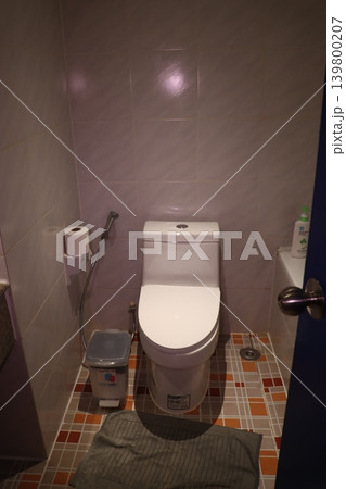 Bathroom Interior with Toilet and Tile Walls Bathroom Interior with Toilet and Tile Walls 139800207