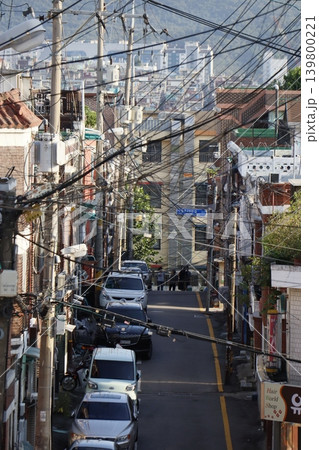 Urban Street with Overhead Wires and Vehicles 139800221