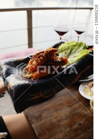 Shrimp and Lettuce Dish on Black Plate Shrimp and Lettuce Dish on Black Plate 139800238