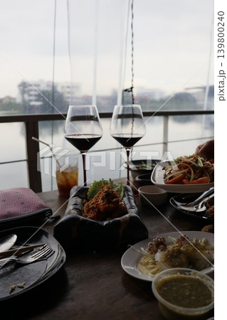 Dining Table with Food and Wine Glasses Dining Table with Food and Wine Glasses 139800240