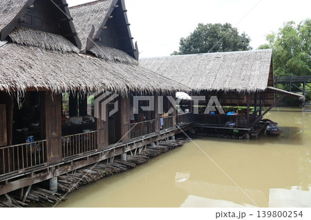 Stilt Houses Over River in Southeast Asia Stilt Houses Over River in Southeast Asia 139800254