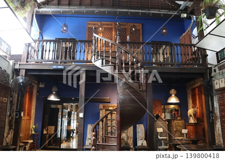 Vintage Spiral Staircase in Blue-Walled Interior Space 139800418