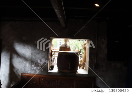 Interior Room with Window and Drum Statue View Interior Room with Window and Drum Statue View 139800420